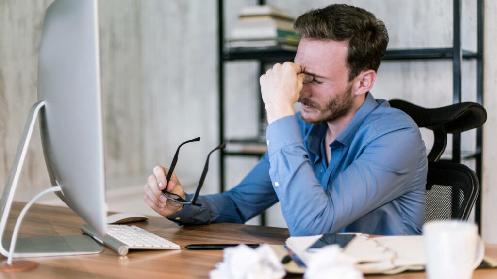 Man worried at the desk