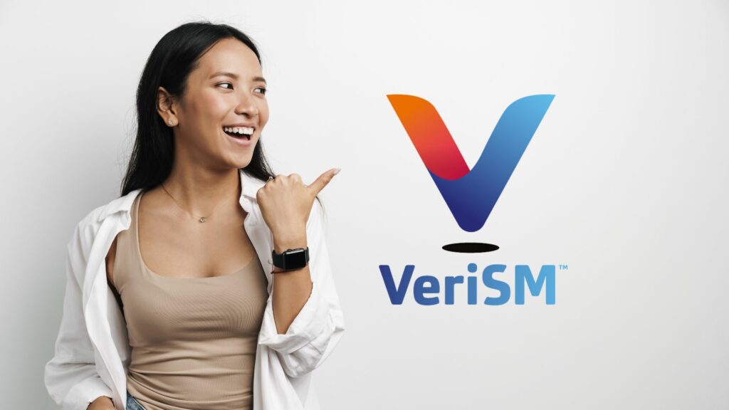 Woman smiling and pointing at VeriSM logo